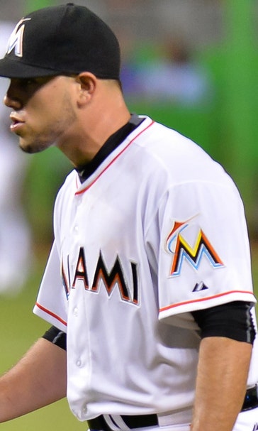 Fernandez improves to 14-0 at home, Marlins blank Reds